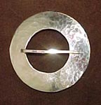 trade silver - round brooch
